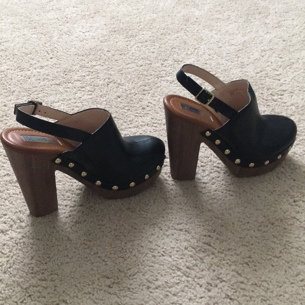 Black studded clogs with wooden bottom. INC brand.